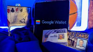 College IDs sitting next to an Android phone with the Google Wallet app logo